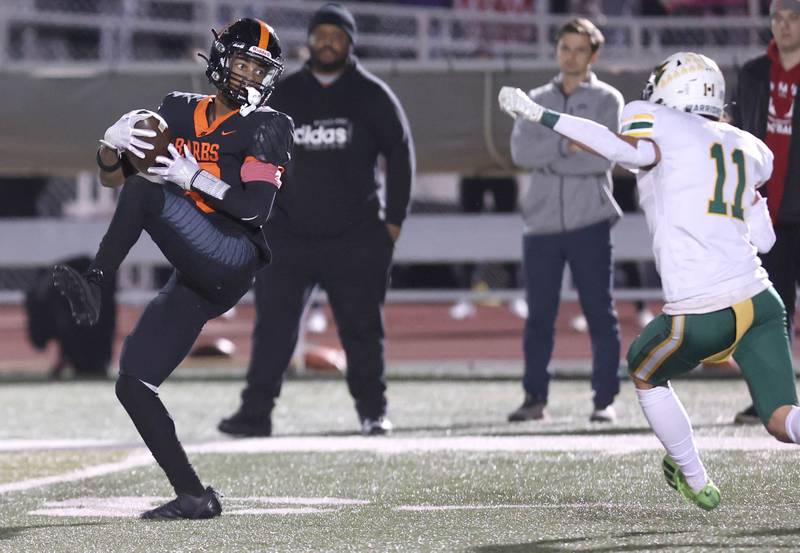 DeKalb's Ethan McCarter makes catch in the Waubonsie Valley secondary during their game Thursday, Oct. 20, 2022, at DeKalb High School.