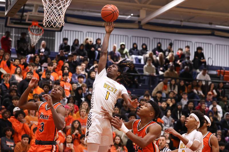 Joliet West’s Justus McNair puts up a shot against Romeoville on Tuesday January 31st, 2023.