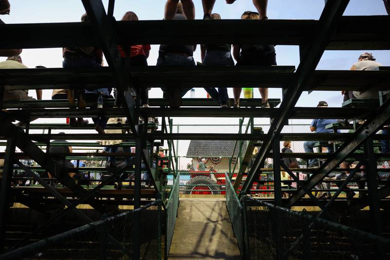 A tractor passes by the grandstands during the Illinois Tractor Pulling Association Truck and Tractor Pull at the Will County Fair on Aug. 21, 2025.