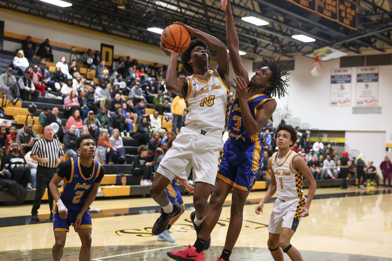 Joliet West’s Abrey Robinson takes the contested shot against Joliet Central on Tuesday, Feb. 17, 2026 in Joliet.