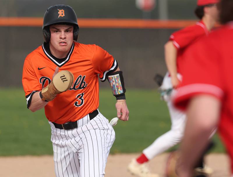 DeKalb's Nikolas Nelson heads for third Monday, April 28, 2025, during their game against Naperville Central at DeKalb High School.