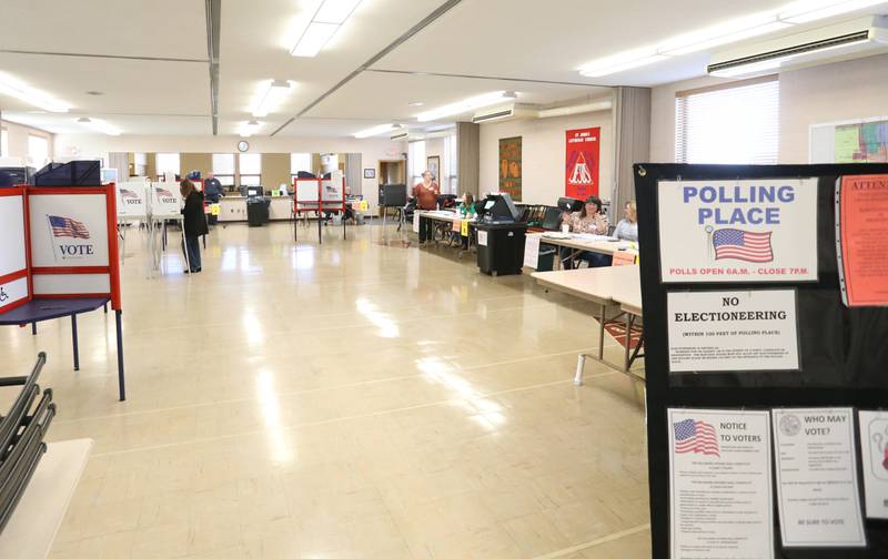 Susan Irwin (left) casts her vote at a polling place on Tuesday, March 19, 2024 at St. John's Lutheran Church in Peru.