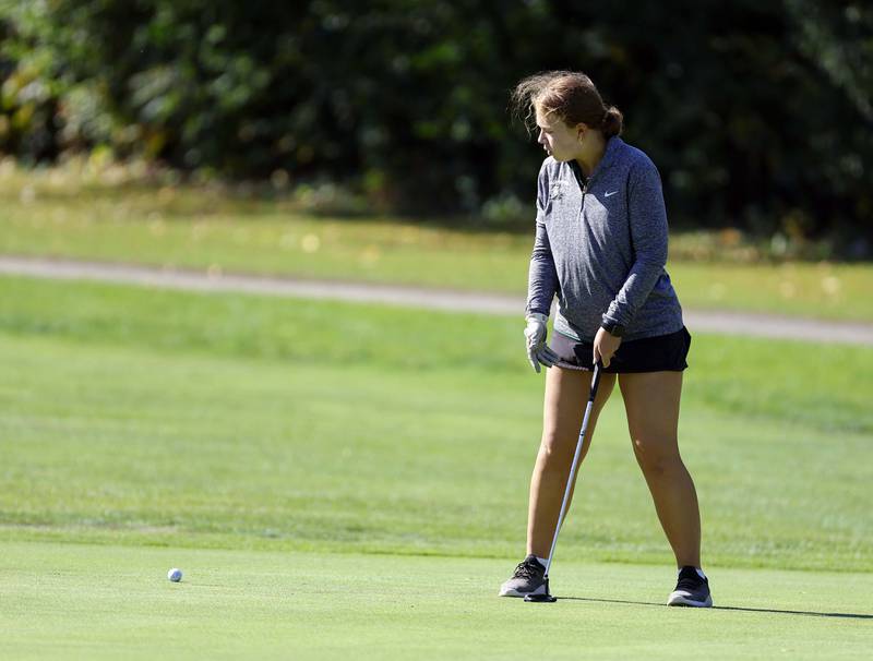 Danielle McCluskey of Glenbard West, watches her putt during the IHSA Class 2A West Chicago girls golf regional at St. Andrews Tuesday, Oct. 1, 2024 in West Chicago.
