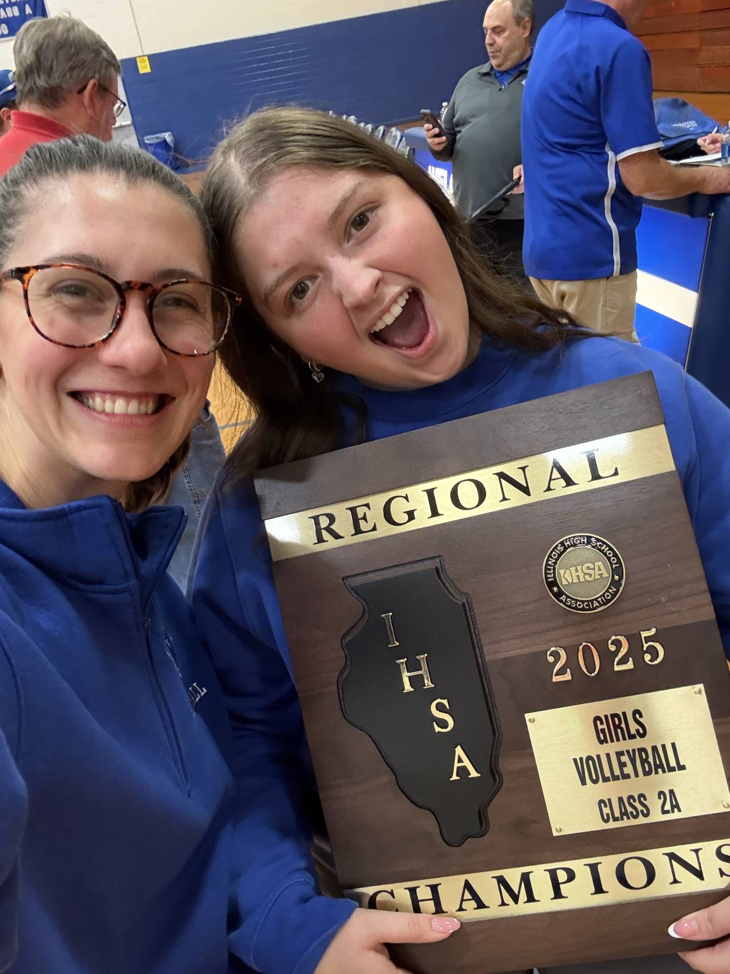 Libby Boyles (right) celebrates Princeton's regional volleyball championship this fall with fellow assistant coach Anna Murray. Boyles, who also played for the Tigresses' regional champions in 2021, has been named as the new head volleyball coach at PHS. She becomes the sixth head coach in program history and youngest at 21.