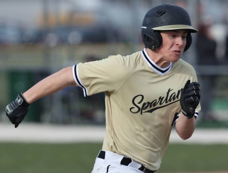 Sycamore's Owen Piazza hustles to first during their game against LaSalle-Peru Monday, April 11, 2022, at the Sycamore Community Sports Complex.