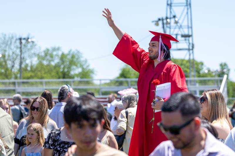 Hayden Sienkiewicz Waves goodbye on Sunday, May 18, 2025 at Hall High School in Spring Valley.