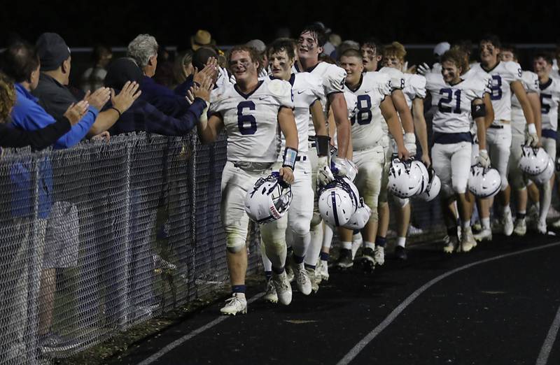 Cary-Grove's Preston Walsh celebrates with his teammates after they defeated Prairie Ridge in a Fox Valley Conference football game on Friday, Sept. 27, 2024, at Prairie Ridge High School.