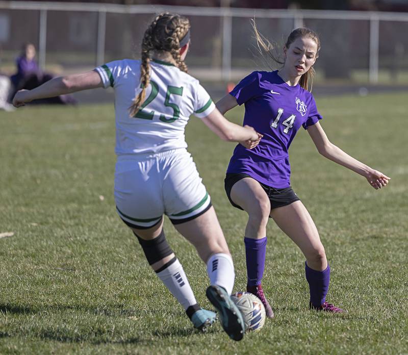 Dixon’s Maggie Van Sickle and North Boone’s Kayla Stamm work against one another Thursday, April 6, 2023.