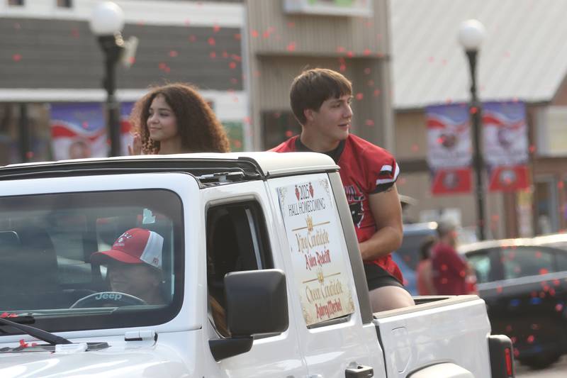 Hall homecoming king candidate Aiden Redcliff and queen candidate Aubrey Merkel ride during the Homecoming parade on Thursday, Sept. 18, 2025 downtown Spring Valley.