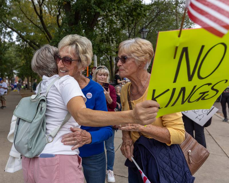 Protesters embrace one another at the ‘No Kings 2.0’ Protest on Saturday, October 18, 2025 at Washington Square Park in Ottawa.