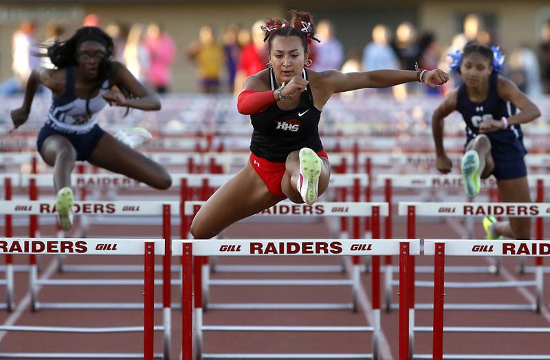 Huntley’s Sophie Amin flies over the last hurdle as she wins the 100 meter hurdles  during the Huntley IHSA Class 3A Girls Sectional Track and Field Meet on Wednesday, May 8, 2024, at Huntley High School.