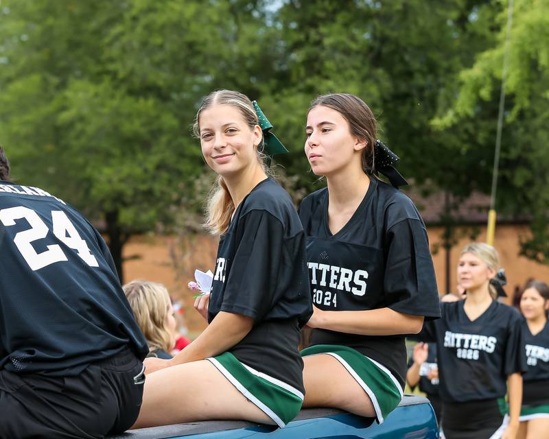 Glenbard West cheerleaders and football players ride in the Glenbard West Homecoming Parade.  Sept 16, 2023