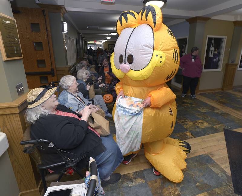 This little Ninja Turtle receives a candy treat at Pleasant View in Ottawa during a special Trick or Treat celebration Friday