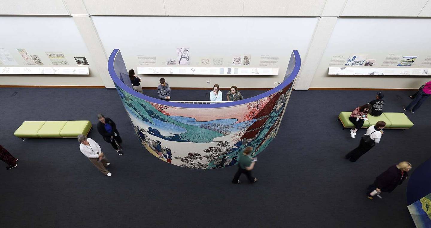 People wander and enjoy a preview of the “Hokusai and Ukiyo-e: The Floating World” exhibition Wednesday at the McAninch Arts Center on the campus of the College of DuPage in Glen Ellyn.