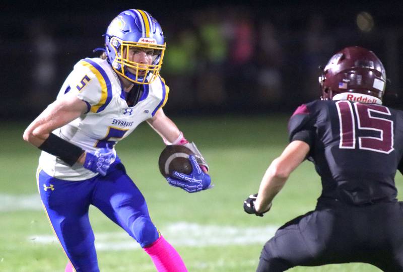 Johnsburg’s Jacob Vetter, left, looks for a way past Marengo’s Alex Sierens in varsity football at Rod Poppe Field on the campus of Marengo High School in Marengo on Friday, Oct. 3, 2025.