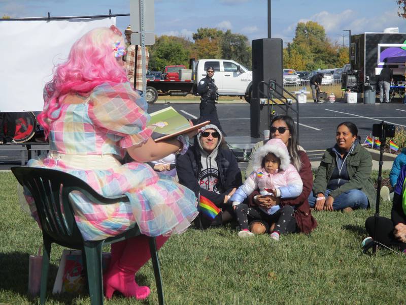 Summer Kornfeind, in drag costume as Cindi Forest, leads a story time for kids at Plainfield Pride Fest on Sunday, Oct. 16, 2022.