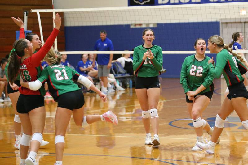 Members of the L-P volleyball team react after defeating Princeton on Tuesday, Aug. 27, 2024 at Princeton High School.