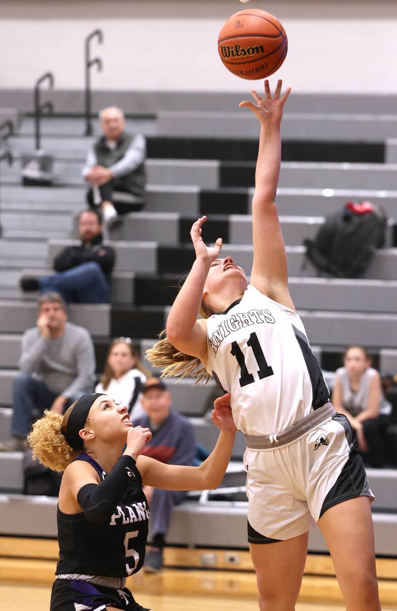 Kaneland’s Berlyn Ruh gets to the basket ahead of Plano's Maddy Leftridge during their game Tuesday, Dec. 13, 2022, at Kaneland High School in Maple Park.