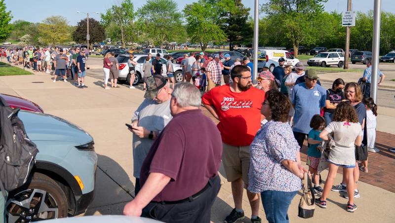 Sean King for the Daily Herald
Kane County Cougars fans wait in line during opening day at Northwestern Medicine Field in Geneva on Friday, May 13, 2022.
