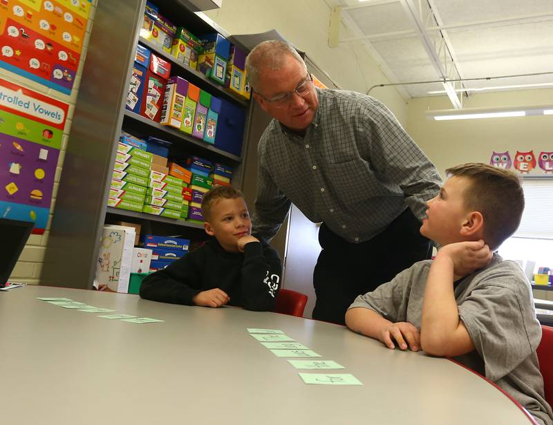 Randy Goodbred, principal at Sheridan Grade School, converses with students Michael Rose Grayson Ohlau on Tuesday May 15, 2022 in Sheridan.