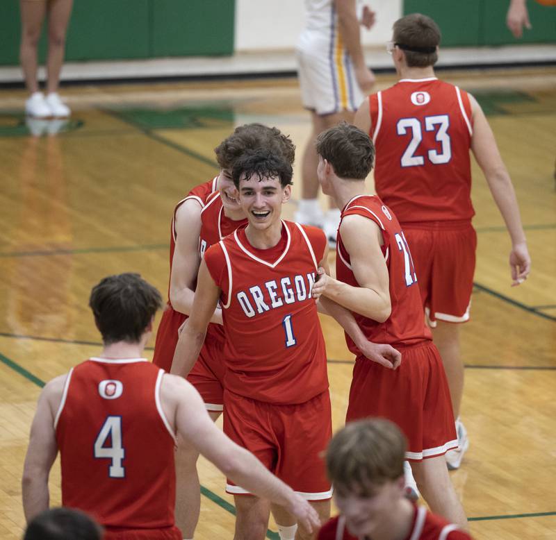 Oregon celebrates after defeating Mendota 65-52 Friday, Feb. 27, 2026, at the Class 2A Rock Falls boys basketball regional.