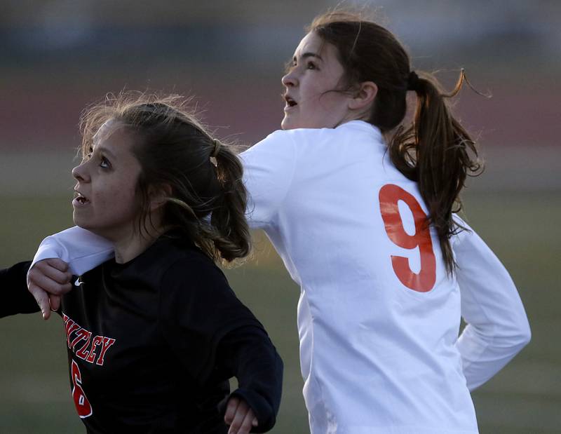 Huntley's Sophie Bator and Crystal Lake Central's Avery Watson battle for position during a Fox Valley Conference  soccer match on Tuesday, April 15, 2025, at Huntley High School.