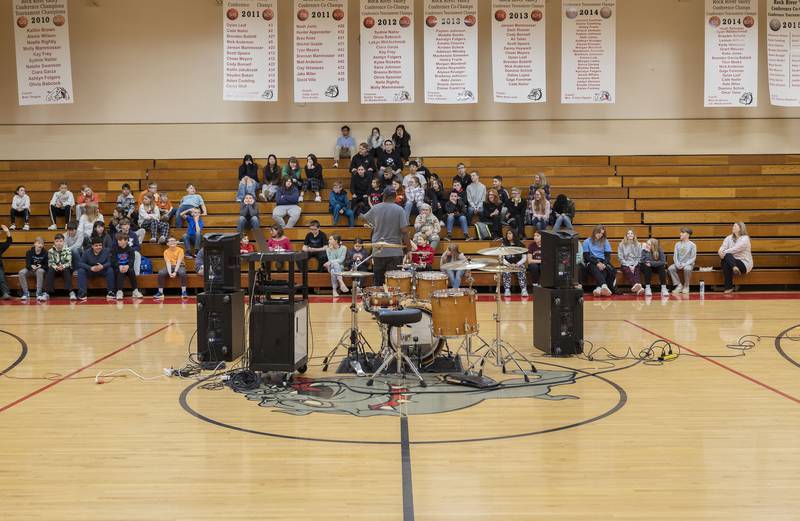 Danya Thompson speaks to students at East Coloma-Nelson school during a drum clinic in Rock Falls Friday, March 24, 2023. The Chicago native learned the drums at age five and quickly fell in love with the craft. Thompson has played with countless musical acts ranging from Destiny’s Child to Hot Hot Robot. Along with being an accomplished musician, Thompson is an educator, producer, musical engineer and composer working in film and TV.