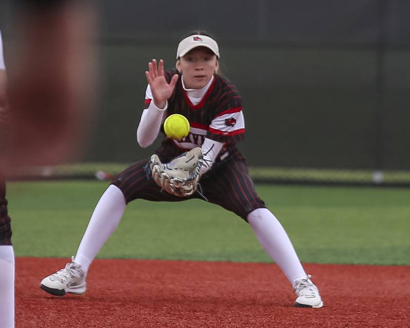 Yorkville's Destiny Barton (00) fields a bouncer to short during softball game between Oswego at Yorkville. May 5, 2026 in Yorkville.