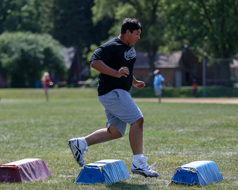 Plainfield Central goes through agility drills at the West Aurora High School Battle of the Big Butts Linemen Challenge.  July 14, 2022.
