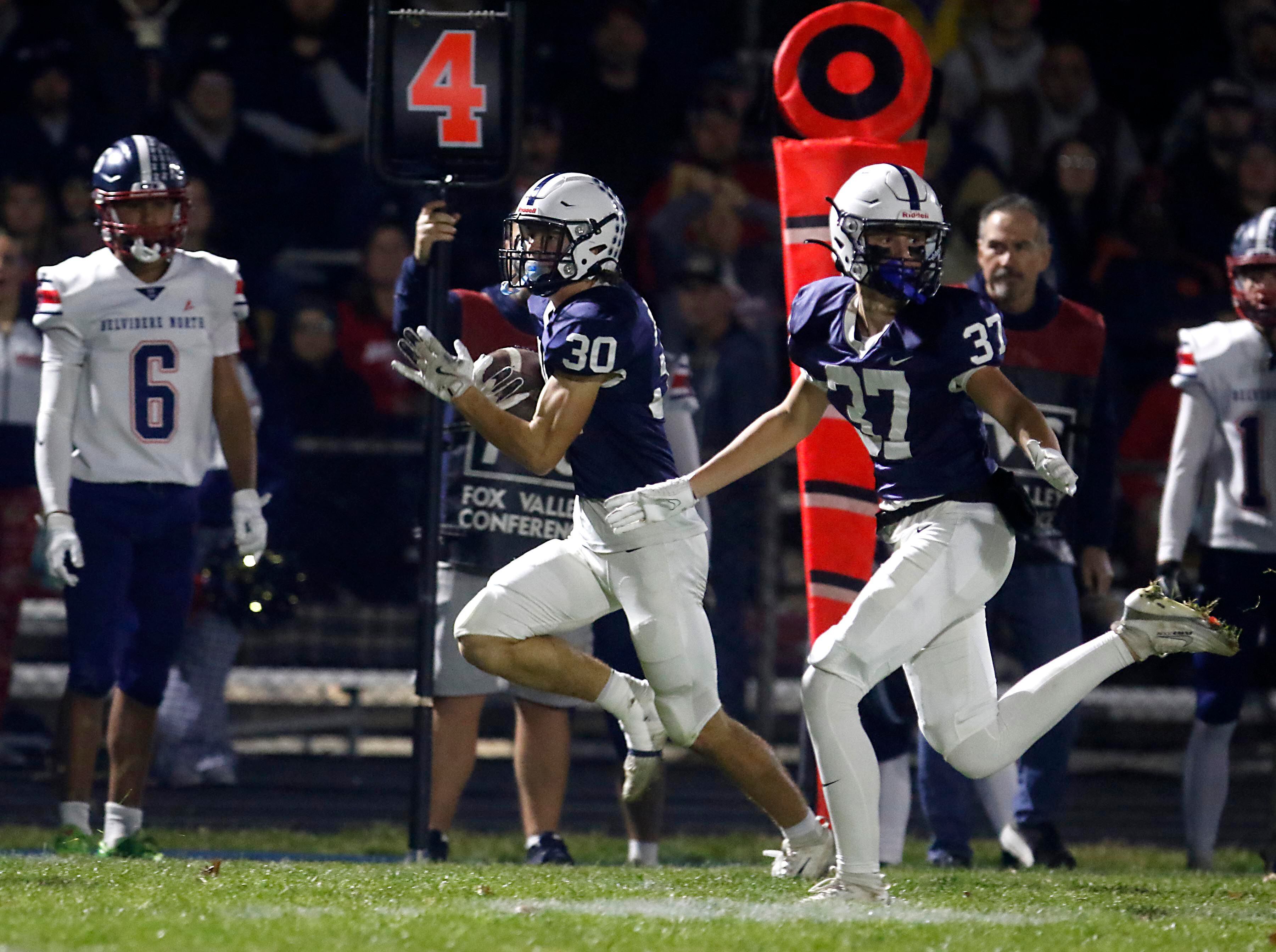 Cary-Grove's Landon Moore returns a Belvidere North punt to the line of scrimmage during an IHSA Class 5A quarterfinal playoff football game on Friday, November 14, 2025, at Cary-Grove High School, in Cary.