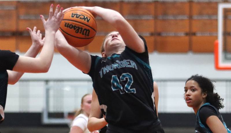 Woodstock North’s Bella Ivers snags a rebound  in varsity girls basketball on Monday, Jan. 26, 2026, at Crystal Lake Central High School in Crystal Lake.