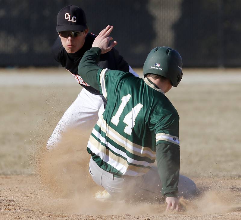 Crystal Lake Central's James Dreher tags out Boylan’s Dominick Faron during a nonconference baseball game Wednesday, March 29, 2023, at Crystal Lake Central High School.