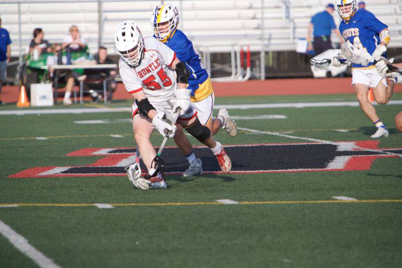 Huntley's Andrew Baumley looks to advance the ball against Lake Forest at the Super Sectional Final on Tuesday, May 30, 2023 in Huntley.