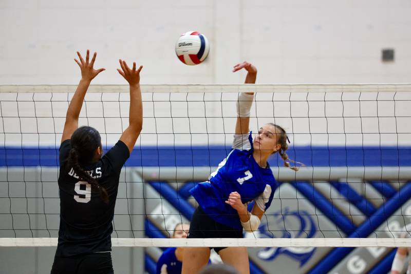 Princeton's Kathy Maciczak (7) hits the ball as Hall's Natalia Zamora puts up a block on Tuesday, Sept. 16, 2025 in Princeton.