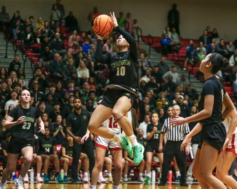 Waubonsie Valley's Danyella Mporokoso (10) goes in for a lay up during their Class 4A Bolingbrook Sectional final basketball game between Waubonsie Valley at Benet. Feb 27, 2025 in Bolingbrook.