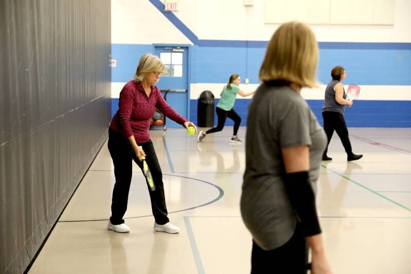 Laurie Clark of St. Charles serves the ball during a pickle ball open gym session at the Pottawatomie Community Center in St. Charles on Jan. 23, 2023.