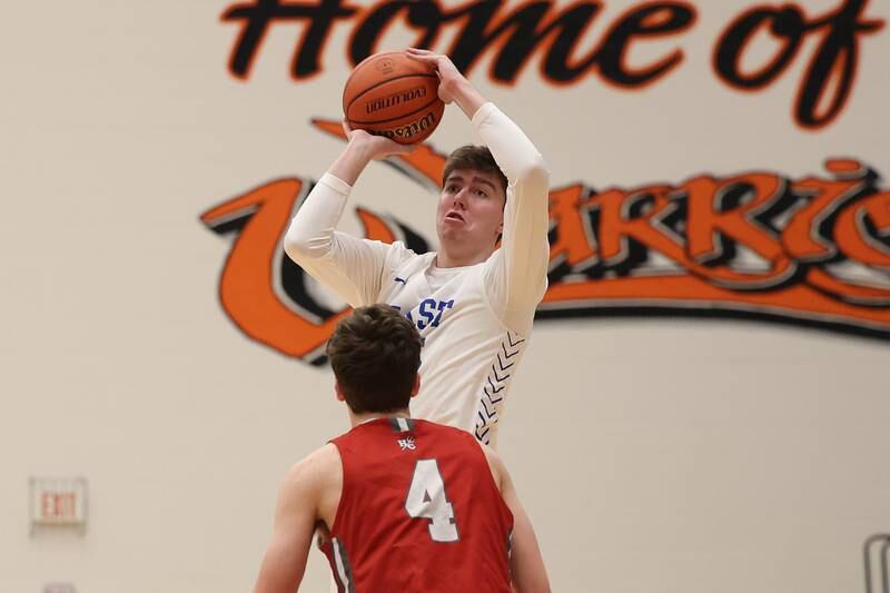 Lincoln-Way East’s Brayden Lovell hits the buzzerbeating three point shot against Hinsdale Central in the Lincoln-Way West Warrior Showdown on Saturday January 28th, 2023.