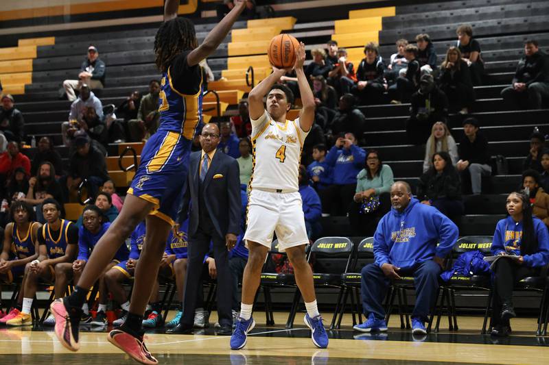 Joliet West’s Brockton Goehrke puts up a three point shot against Joliet Central on Tuesday, Feb. 17, 2026 in Joliet.