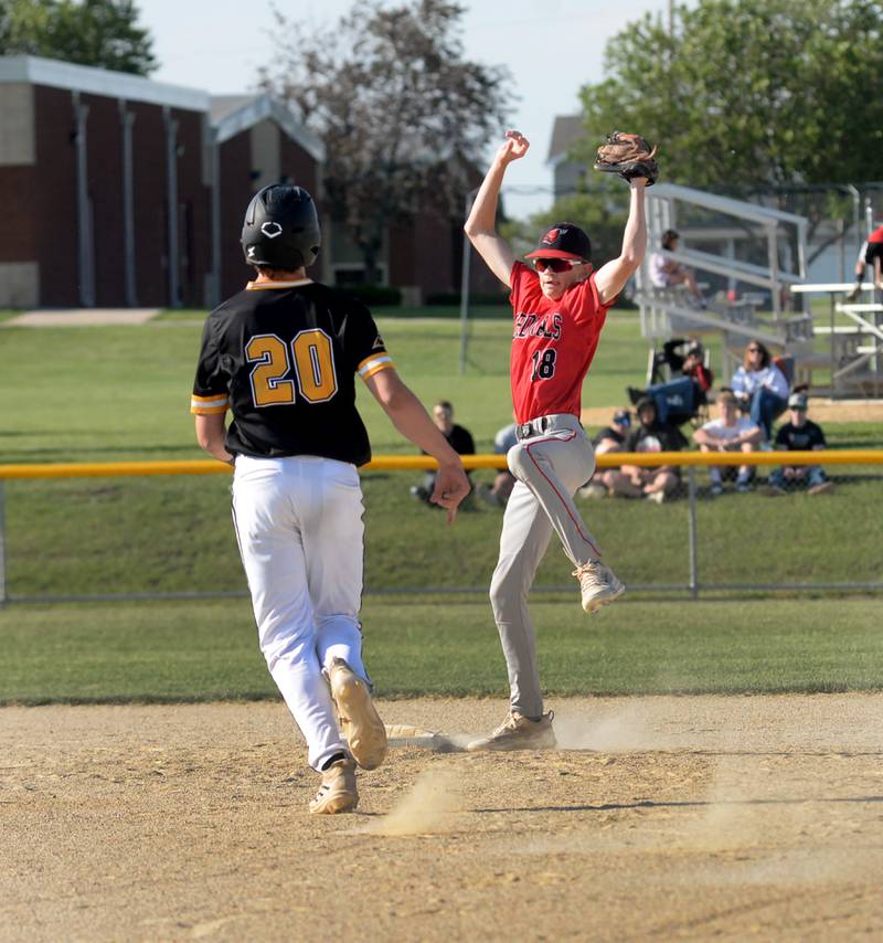Forreston's Brady Gill jumps up to catch a throw before tagging Lena-Winslow's Miles Mahon out at second at the 1A Forreston Sectional on Wednesday, May 22, 2024. The Cardinals won the game 10-4 to advance to the sectional championship on Saturday.