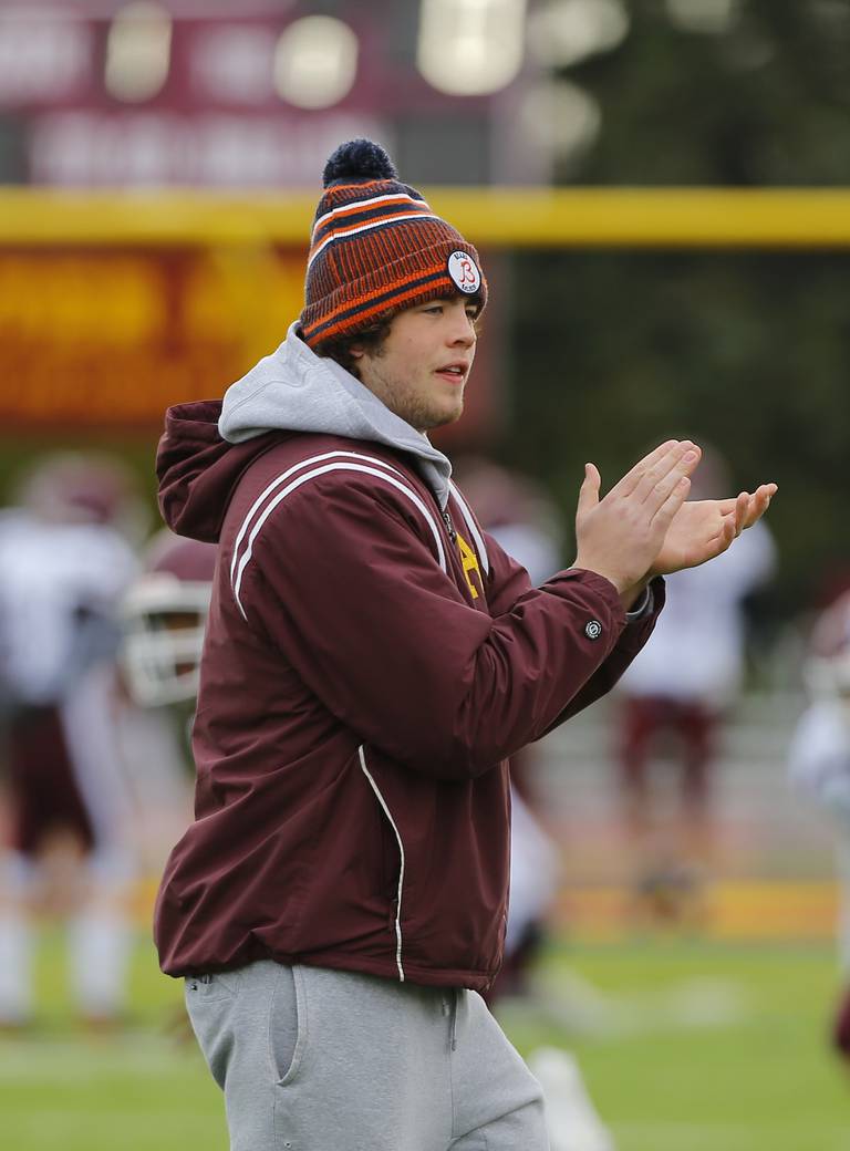 Loyola's James Kyle cheers on his teammates during the IHSA Class 8A varsity football semifinal playoff game