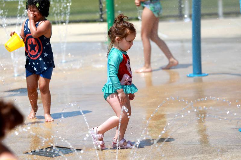 Avery Engelsman, 2, stays cool at the Oswegoland Park District's Prairie Point Splash Pad on Wednesday, June 25, 2025 in Oswego.