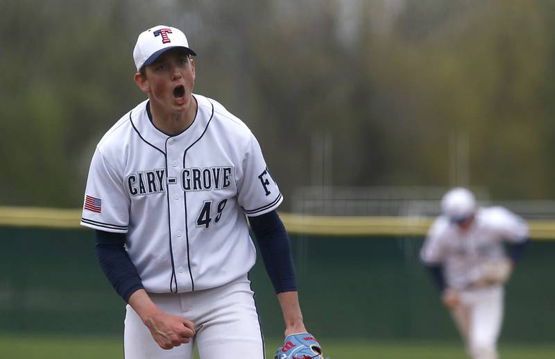 Cary-Grove's Ethan Dorchies celebrates a strike out during a Fox Valley Conference baseball game on Wednesday, April 17, 2024, at Cary-Grove High School. The game was stopped for darkness after the 9th inning with the score tied 6-6.