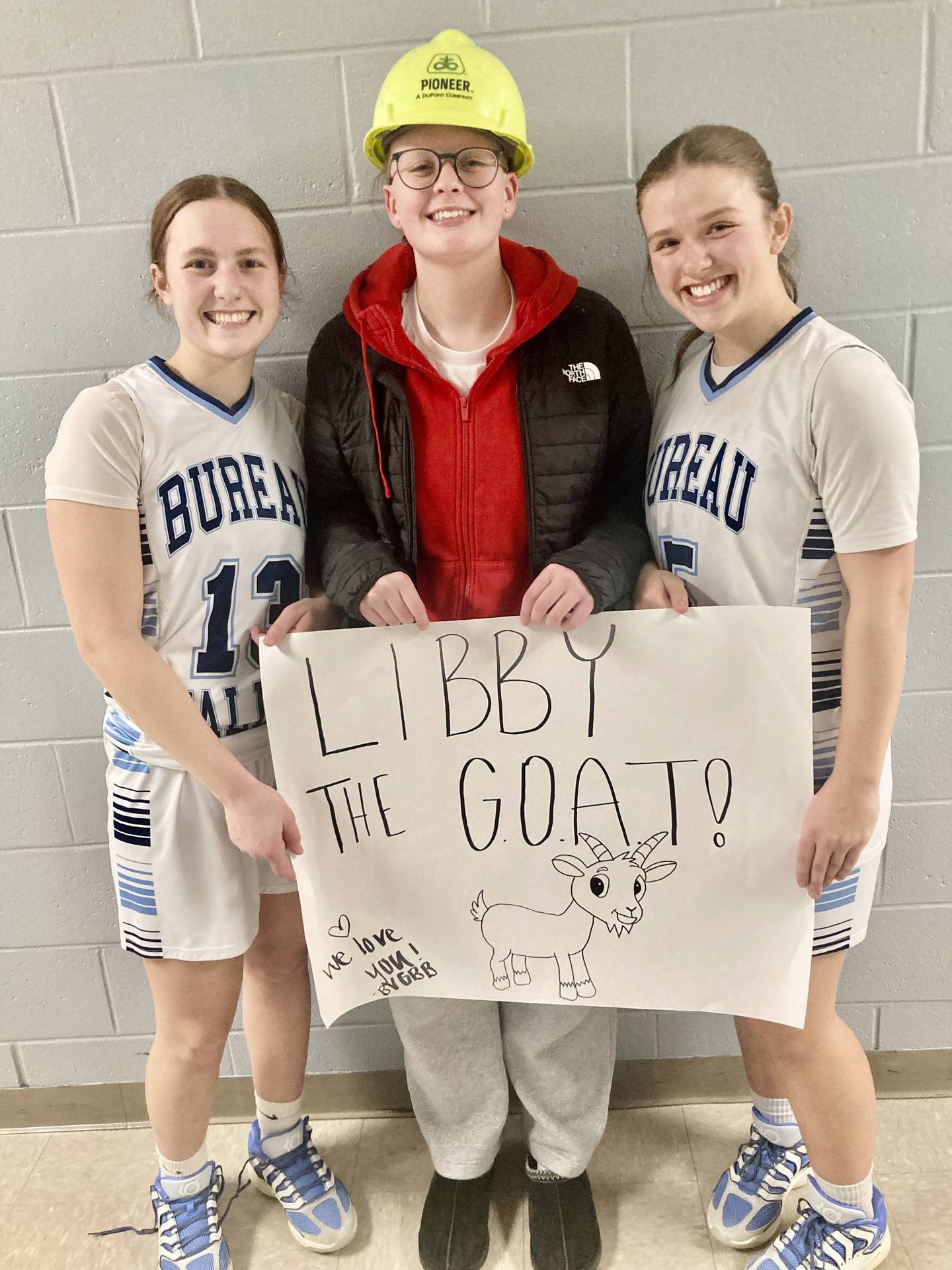 BV senior Alivia Zemke brought out the “Libby the GOAT” sign to honor Storm junior Libby Endress scoring her 1,000th point with 14 points in the Storm's 53-23 win over ROWVA-Williamsfield Wednesday at the Storm Cellar.