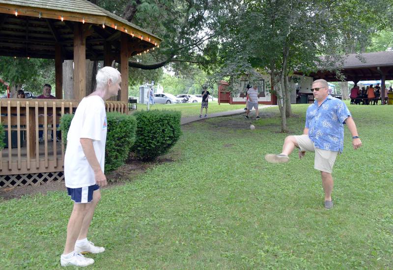 Footbag (hacky sack) world record-holder Andy Linder, of Geneva, left, gives a short lesson on the sport to Tom Zoellner, of Cary, during German Valley Days on July 16. Linder holds four Guinness World Records for footbag as of Jan. 11, 2021, according to the World Footbag Association.