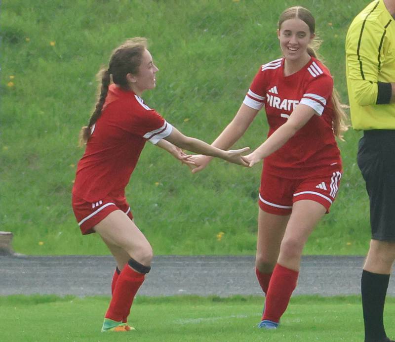 Ottawa's Allison Power hi-fives teammate Kindley Moore after scoring a goal against L-P on Monday, April 13, 2026 on King Field at Ottawa High School.