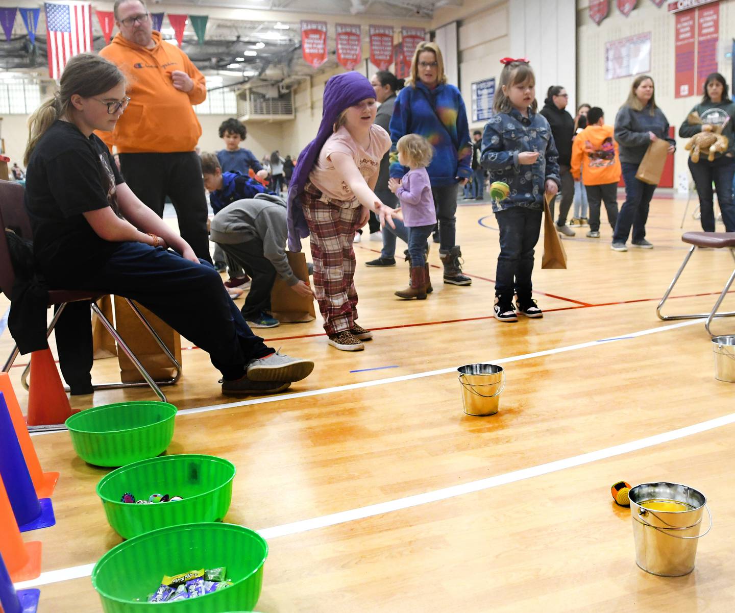 Ulta Zabran, 9, of Byron tosses a ball towards a bucket at the 4-H Penny Carnival on Saturday, March 18. The Leaf River Soaring Eagles 4-H Club offered this game at the fundraising event.