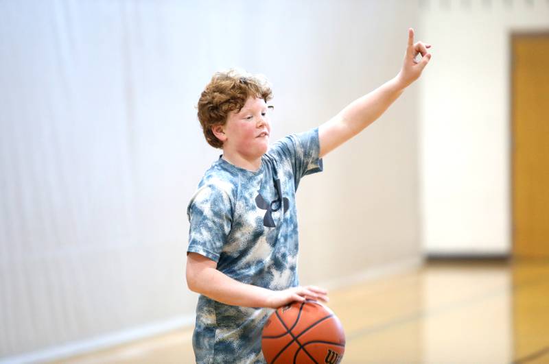 Ethan Klepper, 12, plays basketball during the Middle School Gym Jam at the Downers Grove Park District Recreation Center on Thursday, Jan. 4, 2024.