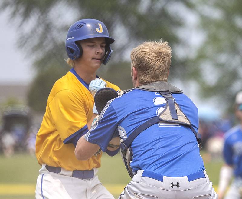 Johnsburg’s Evan Pohl is tagged out at home by Newman’s Daniel Kelly Saturday, May 31, 2025, in the Class 2A Sectional final in Mendota.