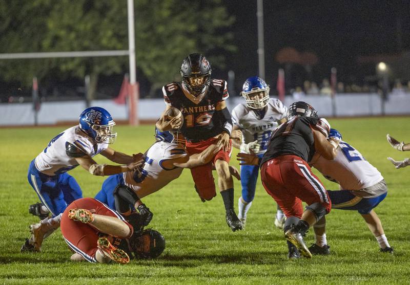 Erie-Prophetstown’s Jeremiah Kochevar leaps through the line against Newman Friday, Sept. 22, 2023 in a game at Erie.