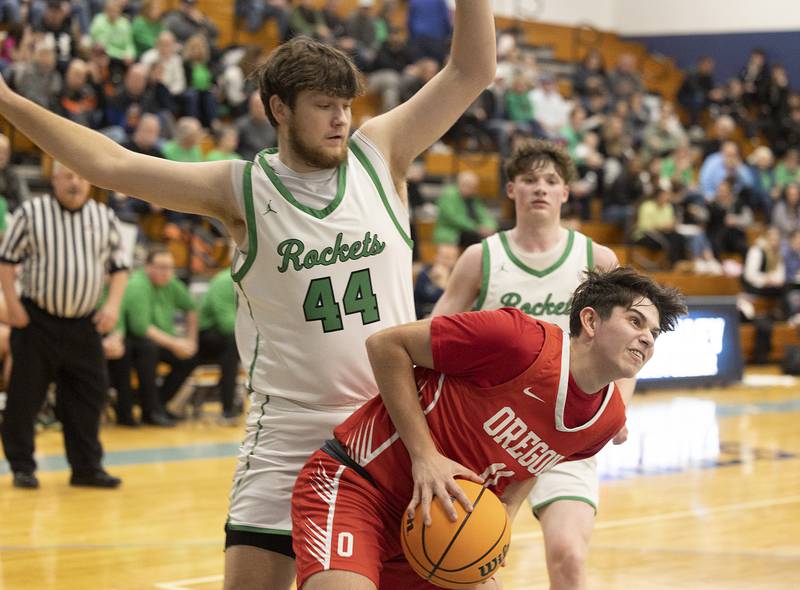 Oregon’s Nole Campos works below the basket against Rock Falls’ Garret Wolf Wednesday, Feb. 26, 2025, at the Class 2A Regional semifinal at Bureau Valley High School.